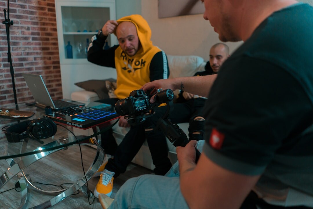 Two people having a recorded interview with a microphone on the table