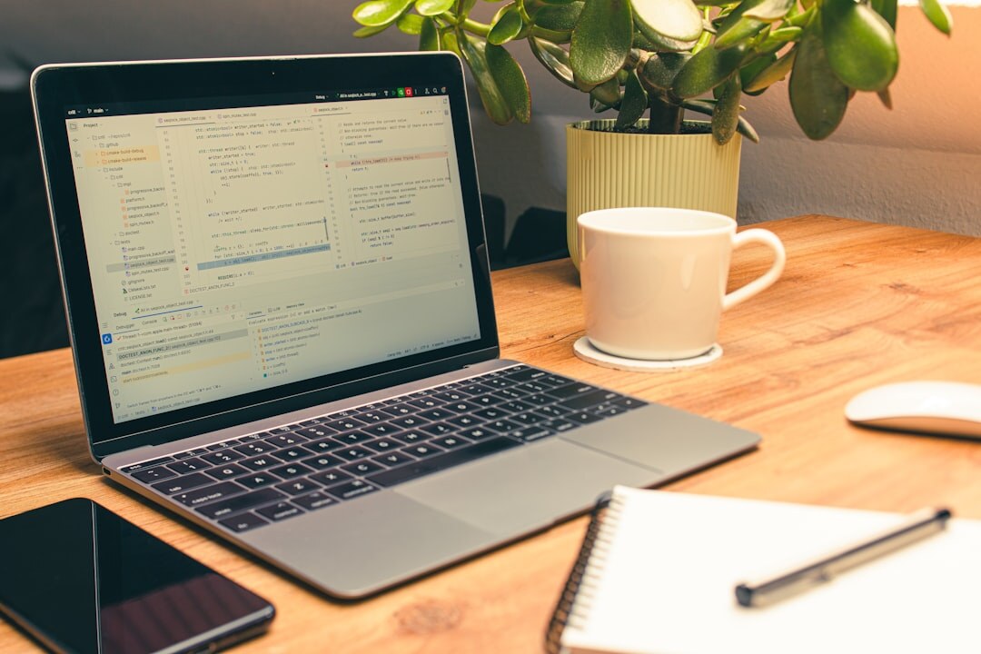 Productivity tools on desk with notebook and digital devices