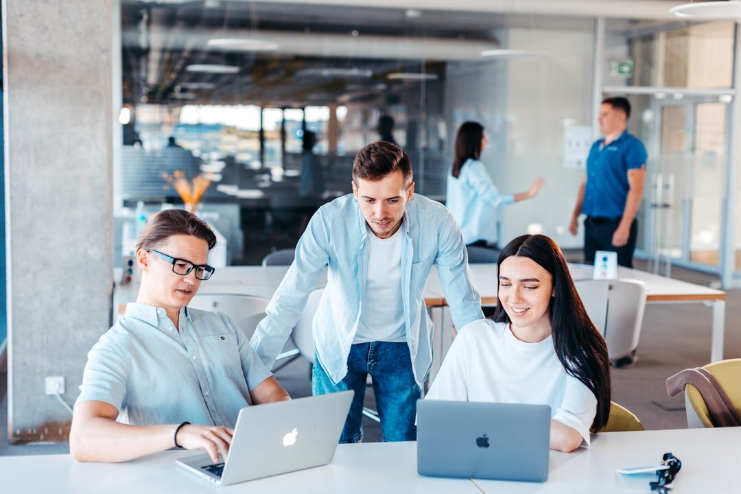 Modern office with team collaborating digitally