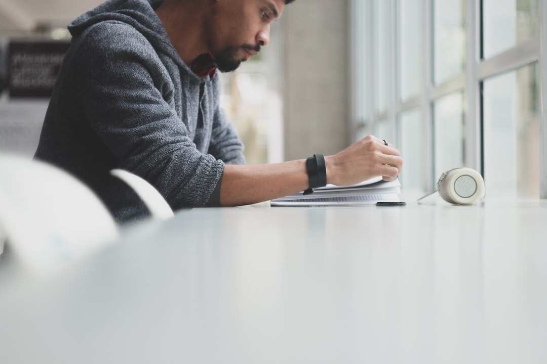 Person focused on work with planner